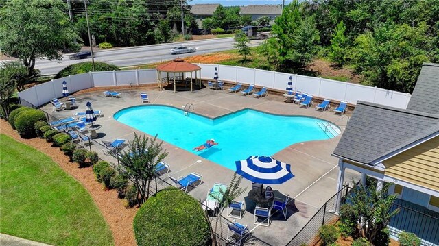 view of swimming pool with a patio and a gazebo