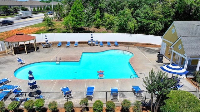 view of pool with a patio area and a gazebo