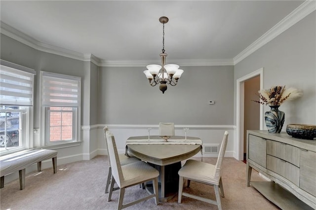 carpeted dining room featuring crown molding and a notable chandelier