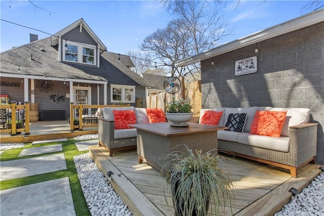 deck featuring fence and an outdoor hangout area