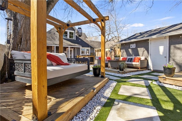 exterior space featuring an outdoor hangout area and a deck