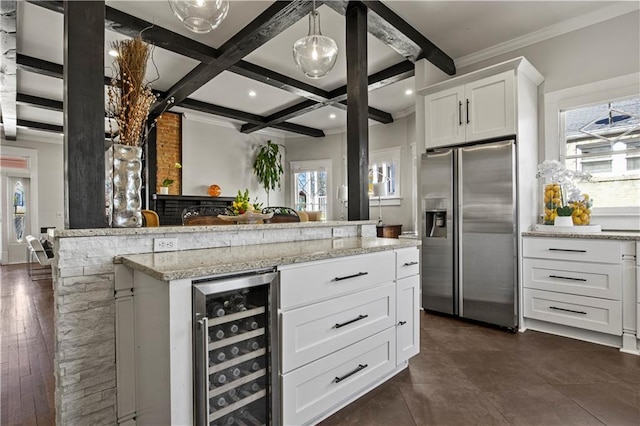 kitchen featuring light stone countertops, beverage cooler, beamed ceiling, stainless steel fridge with ice dispenser, and coffered ceiling