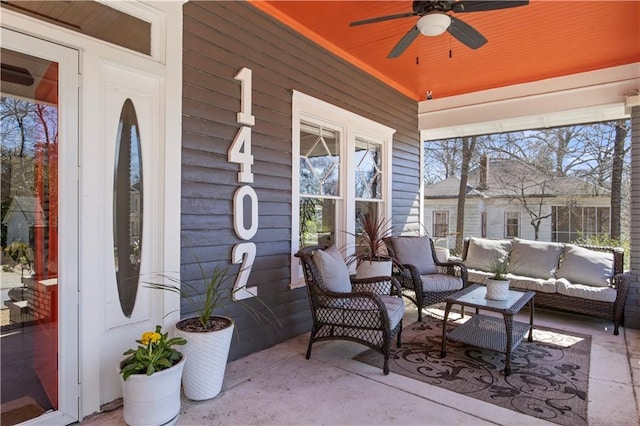 view of patio featuring covered porch, an outdoor hangout area, and a ceiling fan