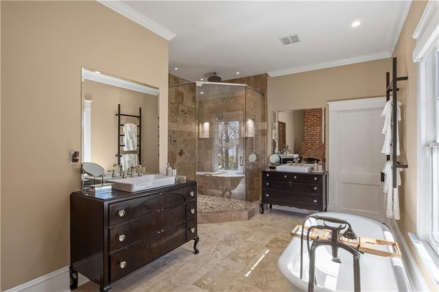 bathroom with ornamental molding, a stall shower, and a sink