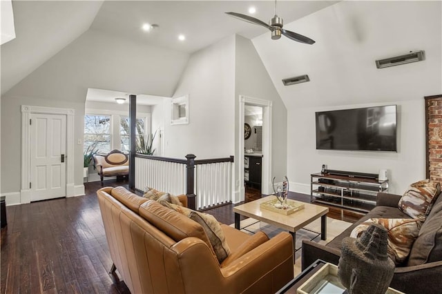 living area with dark wood finished floors, a ceiling fan, visible vents, and baseboards