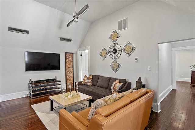 living area with visible vents, baseboards, a ceiling fan, and hardwood / wood-style flooring