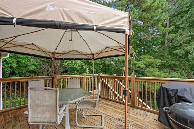 75 Mcpherson Ln, Bremen, GA 30110 - deck with outdoor dining area and a grill