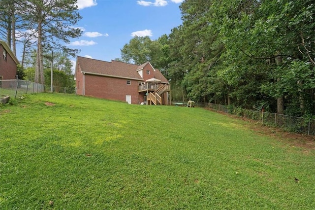 75 Mcpherson Ln, Bremen, GA 30110 - fenced backyard featuring stairs and a wooden deck