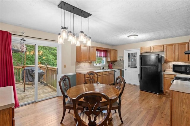 75 Mcpherson Ln, Bremen, GA 30110 - dining room with light wood finished floors, plenty of natural light, and a textured ceiling