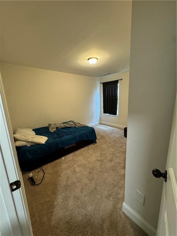 240 Sugar Maple Dr, Cornelia, GA 30531 - carpeted bedroom with baseboards