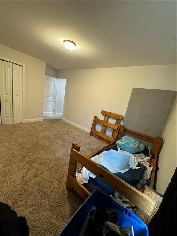 240 Sugar Maple Dr, Cornelia, GA 30531 - carpeted bedroom featuring baseboards and a closet