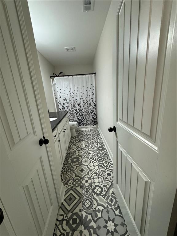 240 Sugar Maple Dr, Cornelia, GA 30531 - bathroom featuring vanity and a shower with shower curtain