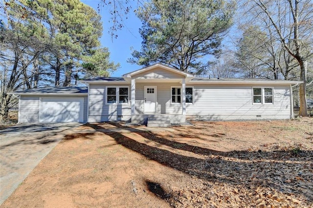 single story home featuring covered porch and a garage