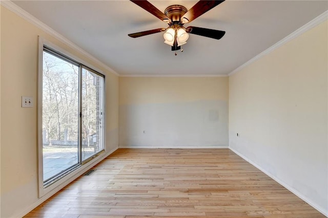 empty room with crown molding, ceiling fan, and light hardwood / wood-style flooring