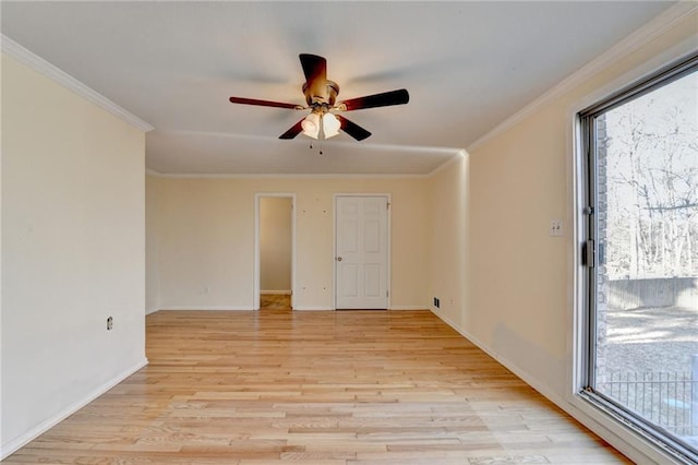 unfurnished room featuring ceiling fan, ornamental molding, light hardwood / wood-style flooring, and plenty of natural light