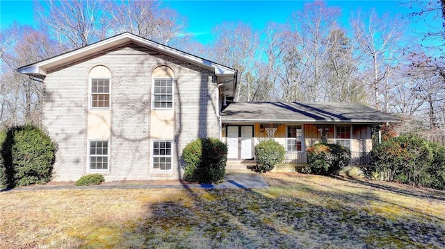 view of front of home with a front lawn and a porch