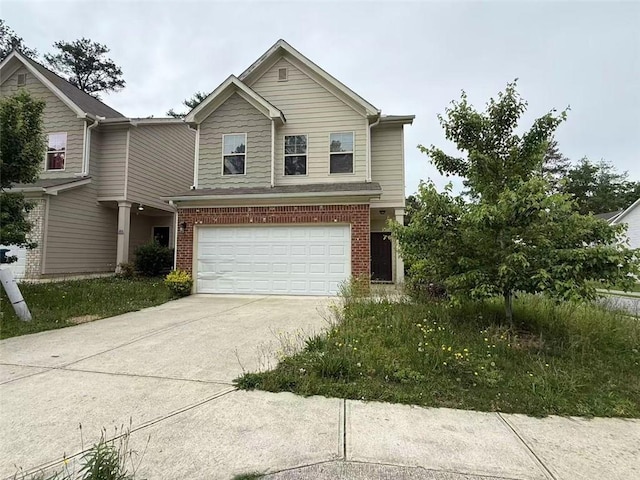 2335 Hackamore Dr, Atlanta, GA 30349 - traditional-style home with a garage, brick siding, and concrete driveway
