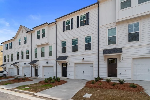 3151 Washburn St SW, Atlanta, GA 30354 - multi unit property featuring board and batten siding, a garage, and driveway