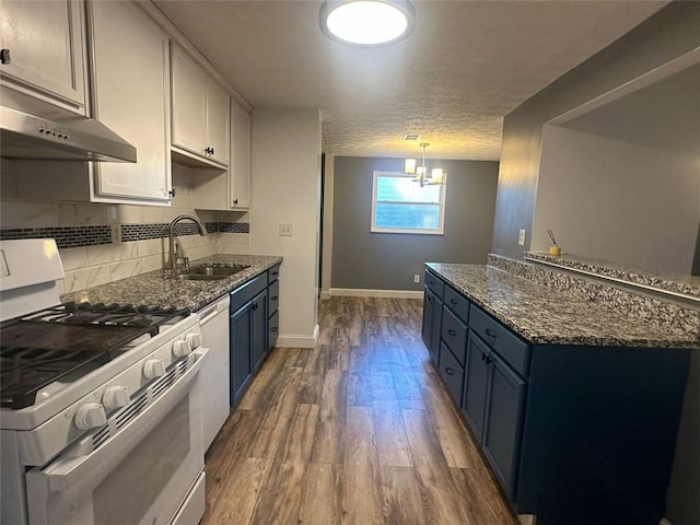 kitchen featuring white cabinetry, sink, white gas range, and blue cabinets