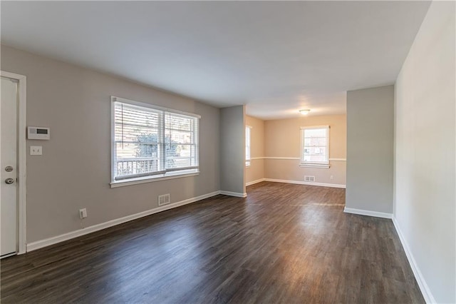 unfurnished room featuring dark hardwood / wood-style floors