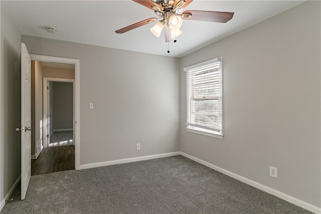 carpeted empty room with ceiling fan