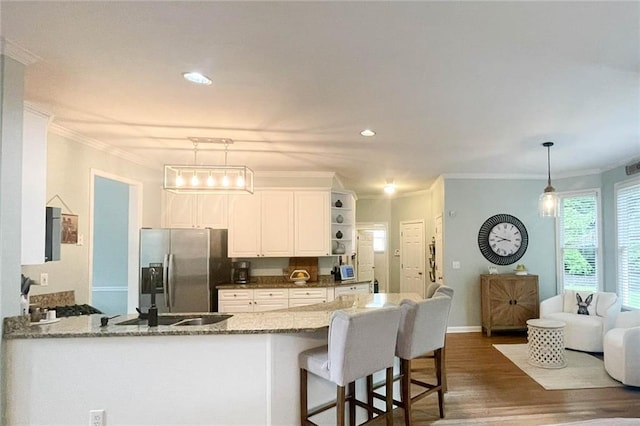 310 Hillpine Dr, Woodstock, GA 30189 - kitchen with stainless steel fridge with ice dispenser, dark wood finished floors, white cabinetry, stone counters, and a peninsula