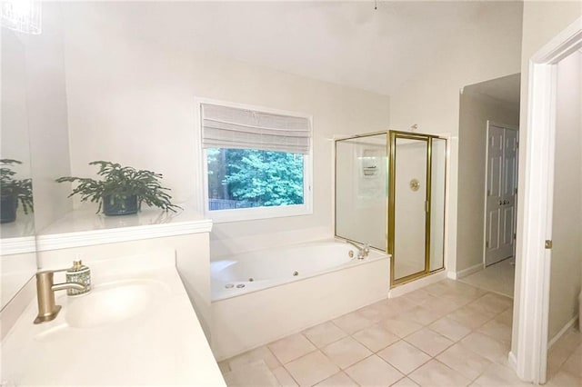 310 Hillpine Dr, Woodstock, GA 30189 - bathroom with a jetted tub, a shower stall, tile patterned floors, and vanity