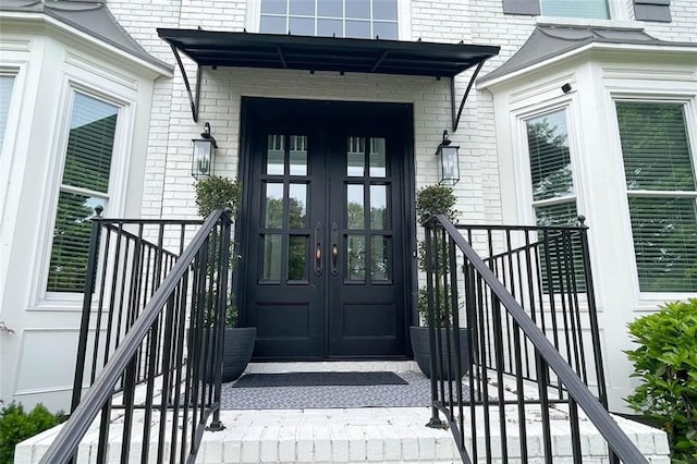 310 Hillpine Dr, Woodstock, GA 30189 - doorway to property with french doors and brick siding