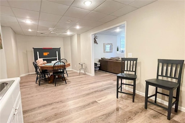 310 Hillpine Dr, Woodstock, GA 30189 - dining room featuring light wood-style flooring, baseboards, ceiling fan, and a paneled ceiling