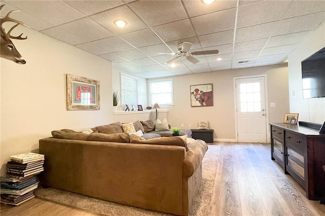 310 Hillpine Dr, Woodstock, GA 30189 - living room with wood finished floors, ceiling fan, a drop ceiling, plenty of natural light, and baseboards
