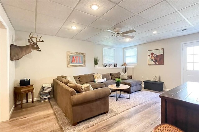 310 Hillpine Dr, Woodstock, GA 30189 - living room with light wood finished floors, ceiling fan, a paneled ceiling, and baseboards