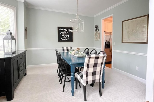 310 Hillpine Dr, Woodstock, GA 30189 - dining space featuring a chandelier, ornamental molding, light colored carpet, and baseboards