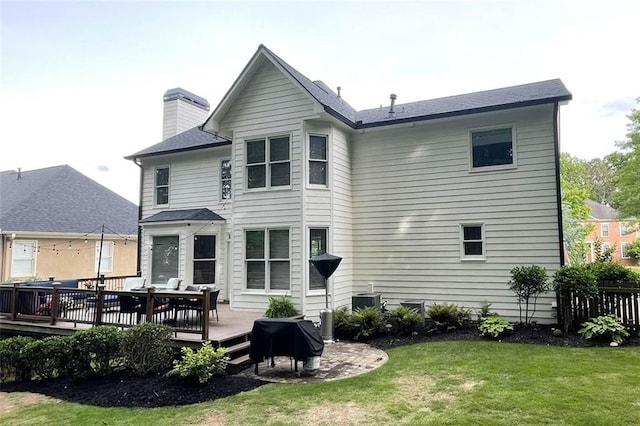 310 Hillpine Dr, Woodstock, GA 30189 - rear view of property with a wooden deck, a lawn, and a chimney