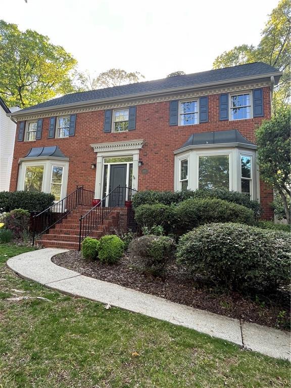 view of front of house with brick siding
