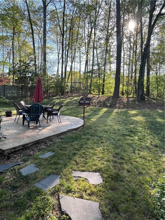 view of yard featuring a patio area and fence