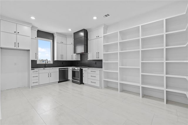 kitchen with stainless steel gas stove, visible vents, white cabinetry, custom exhaust hood, and dishwasher