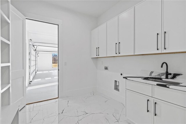 washroom featuring washer hookup, a sink, marble finish floor, cabinet space, and electric dryer hookup