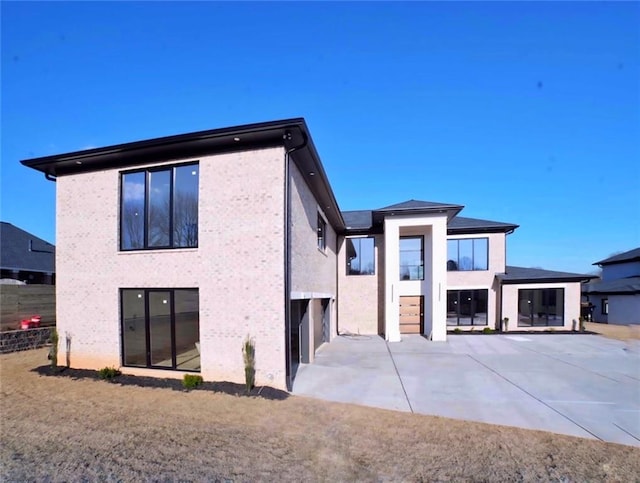 view of property exterior with a patio area