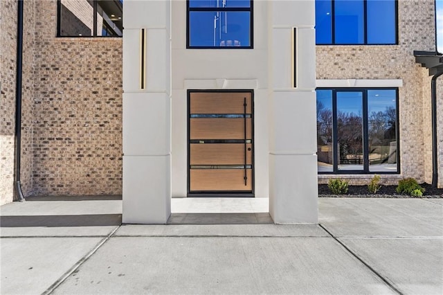 doorway to property with stucco siding