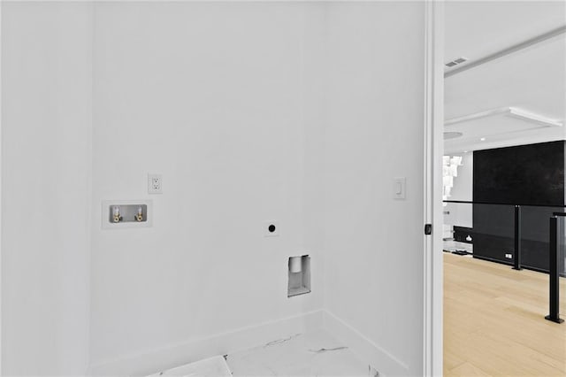 laundry room with laundry area, baseboards, visible vents, wood finished floors, and hookup for a washing machine