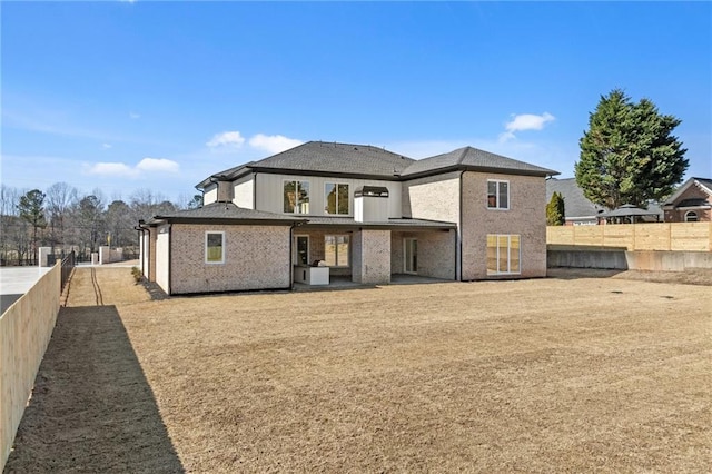 back of house featuring a fenced backyard