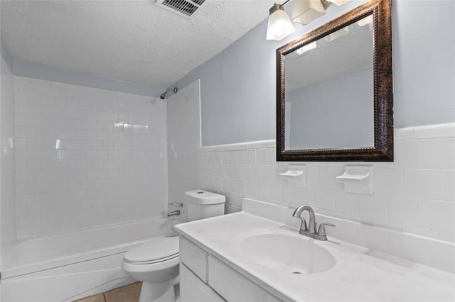 3626 Buford Hwy NE Unit C1, Brookhaven, GA 30329 - full bath with toilet, vanity, a textured ceiling, bathing tub / shower combination, and tile walls
