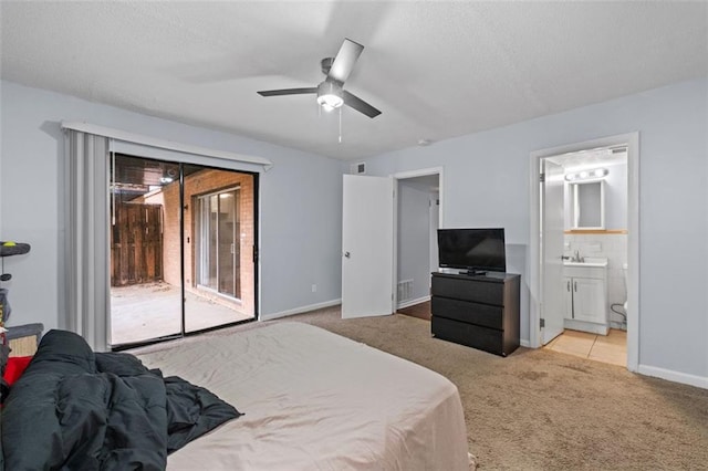 3626 Buford Hwy NE Unit C1, Brookhaven, GA 30329 - bedroom with access to exterior, carpet flooring, a textured ceiling, connected bathroom, and baseboards
