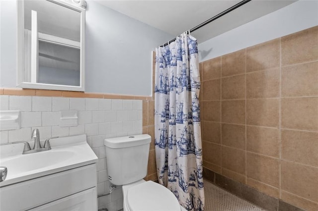 3626 Buford Hwy NE Unit C1, Brookhaven, GA 30329 - full bath with toilet, a tile shower, vanity, tile walls, and wainscoting