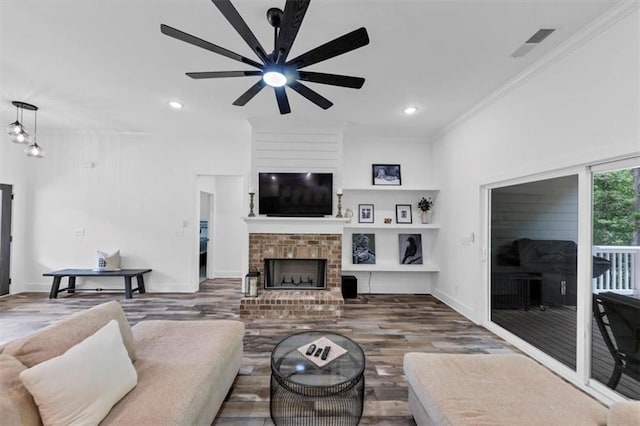 1021 Windsor Creek Dr, Madison, GA 30650 - living area with ceiling fan, ornamental molding, recessed lighting, wood finished floors, and a fireplace