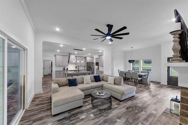 1021 Windsor Creek Dr, Madison, GA 30650 - living room with dark wood finished floors, ornamental molding, ceiling fan, and recessed lighting