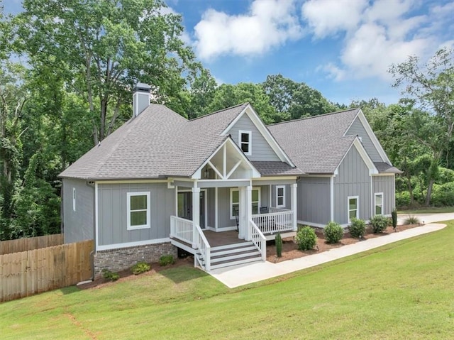 1021 Windsor Creek Dr, Madison, GA 30650 - craftsman house featuring board and batten siding, covered porch, roof with shingles, and a chimney