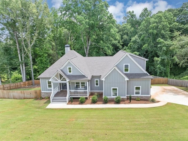 1021 Windsor Creek Dr, Madison, GA 30650 - craftsman inspired home with covered porch, board and batten siding, a shingled roof, and a chimney