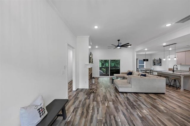 1021 Windsor Creek Dr, Madison, GA 30650 - living room featuring dark wood-style floors, recessed lighting, a ceiling fan, and ornamental molding