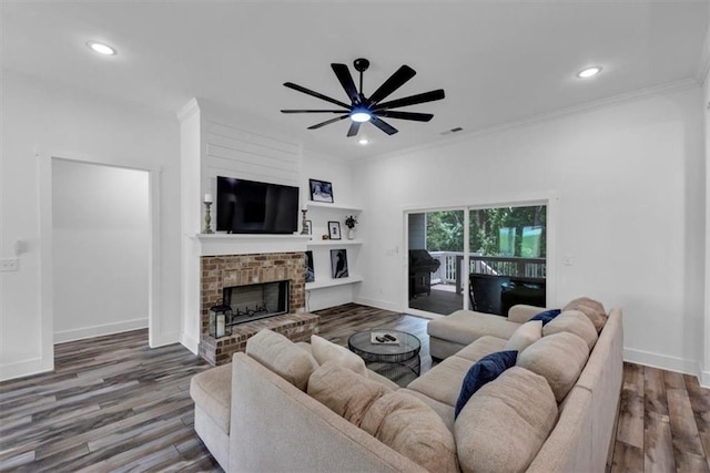 1021 Windsor Creek Dr, Madison, GA 30650 - living room featuring crown molding, wood finished floors, a ceiling fan, recessed lighting, and a fireplace